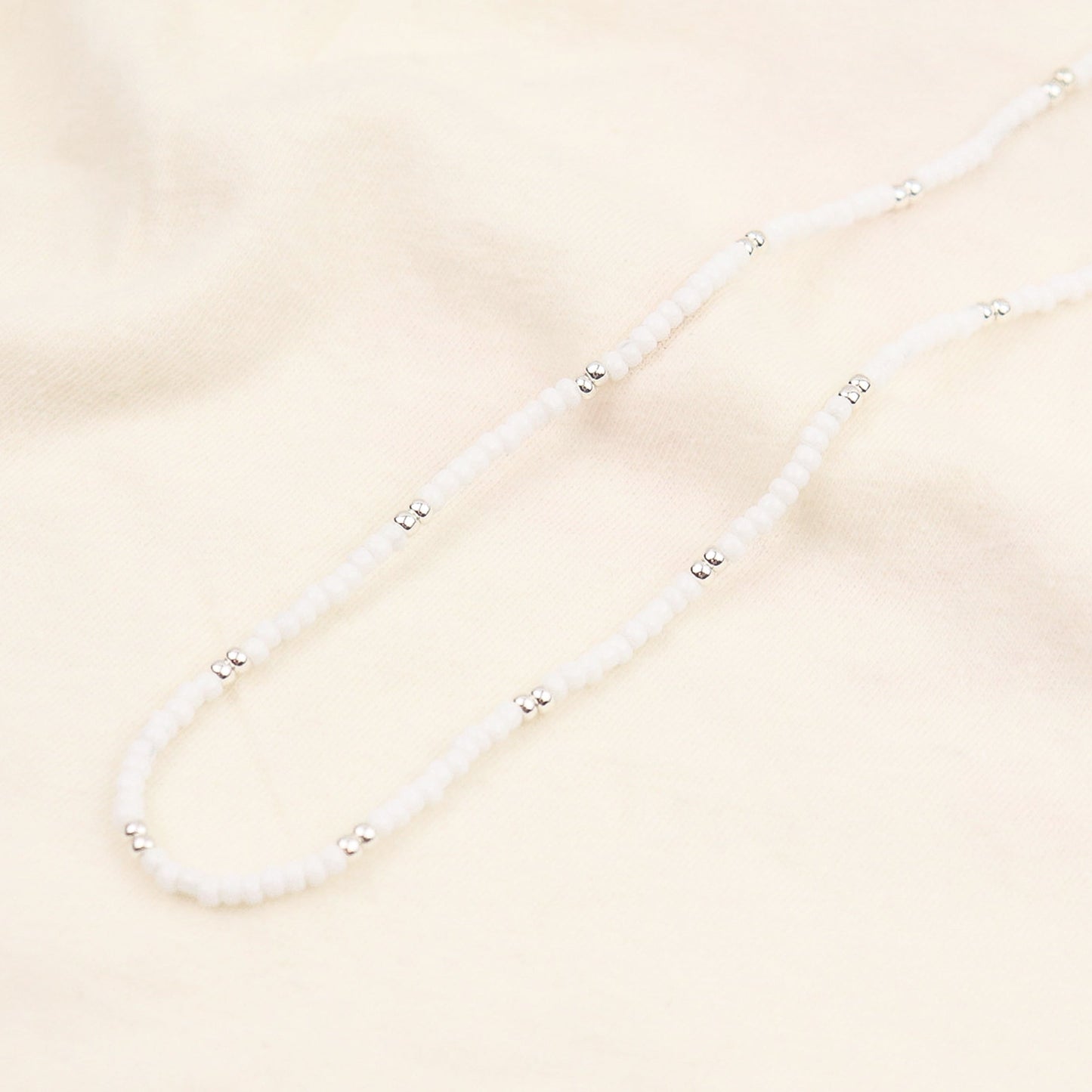 POT OF SILVER NECKLACE